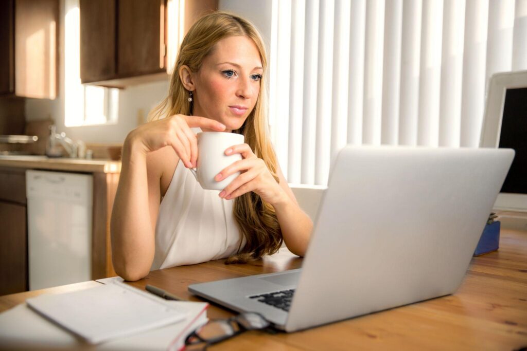 Frustrated writer staring at unfinished manuscript late at night
